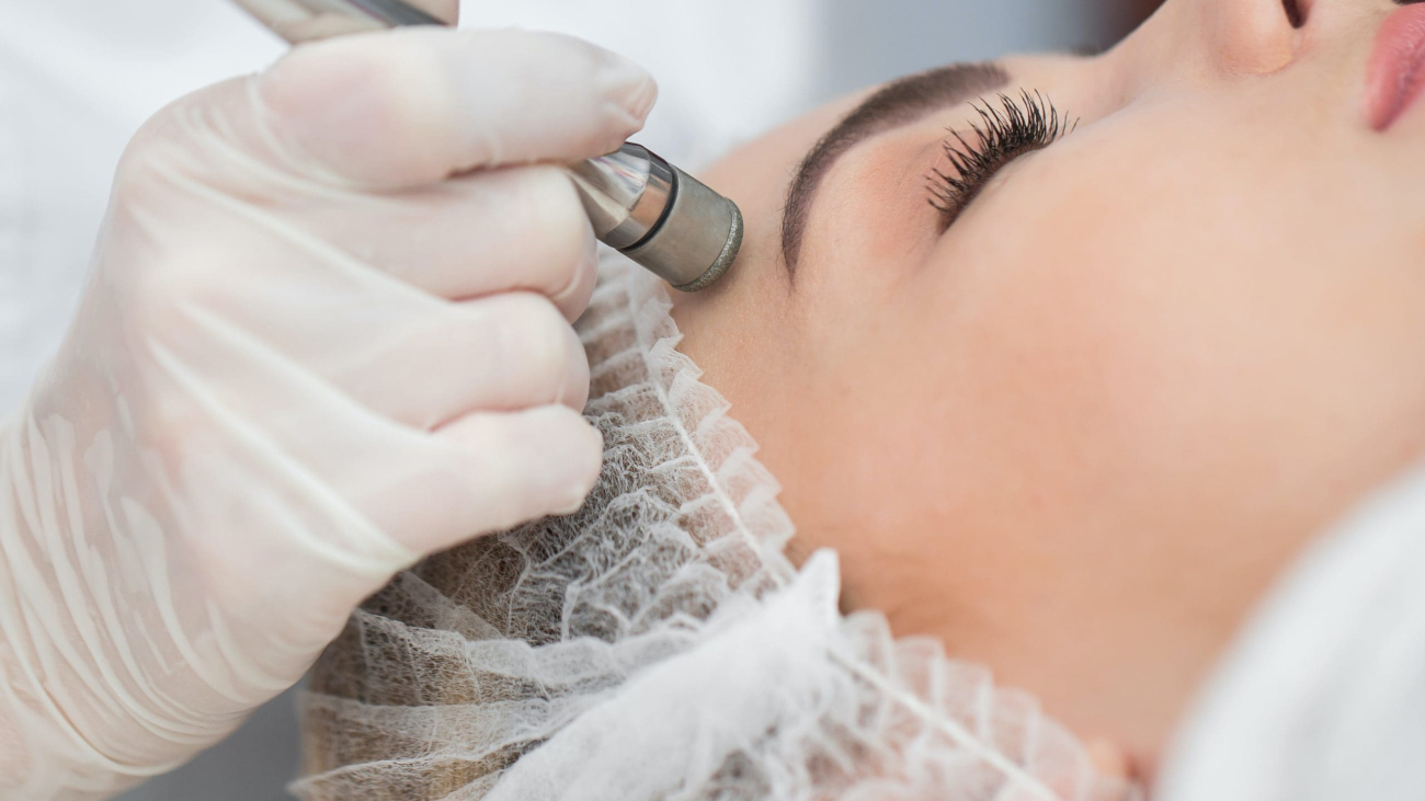 Diamond microdermabrasion, peeling cosmetic. woman during a microdermabrasion treatment in beauty salon