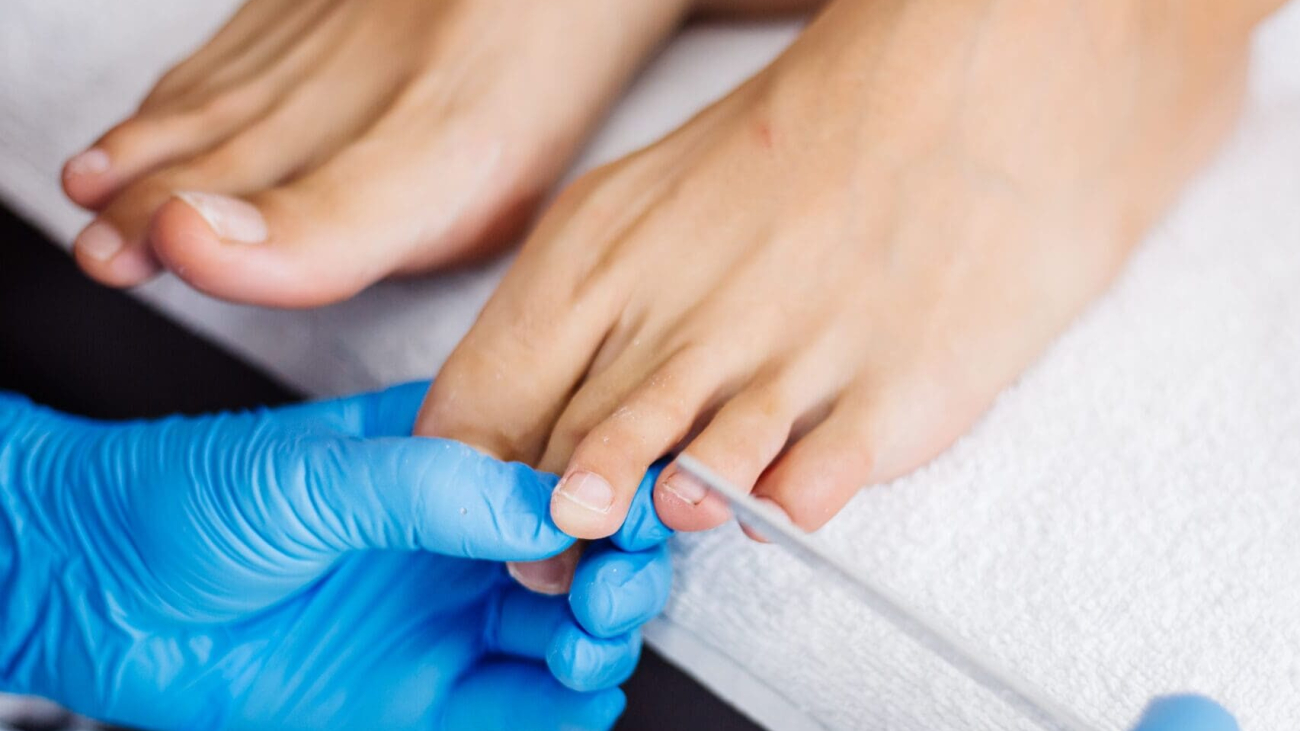 pedicure-process-home-salon-pedicure-foot-care-treatment-nail-process-professional-pedicures-master-blue-gloves-make-pedicure